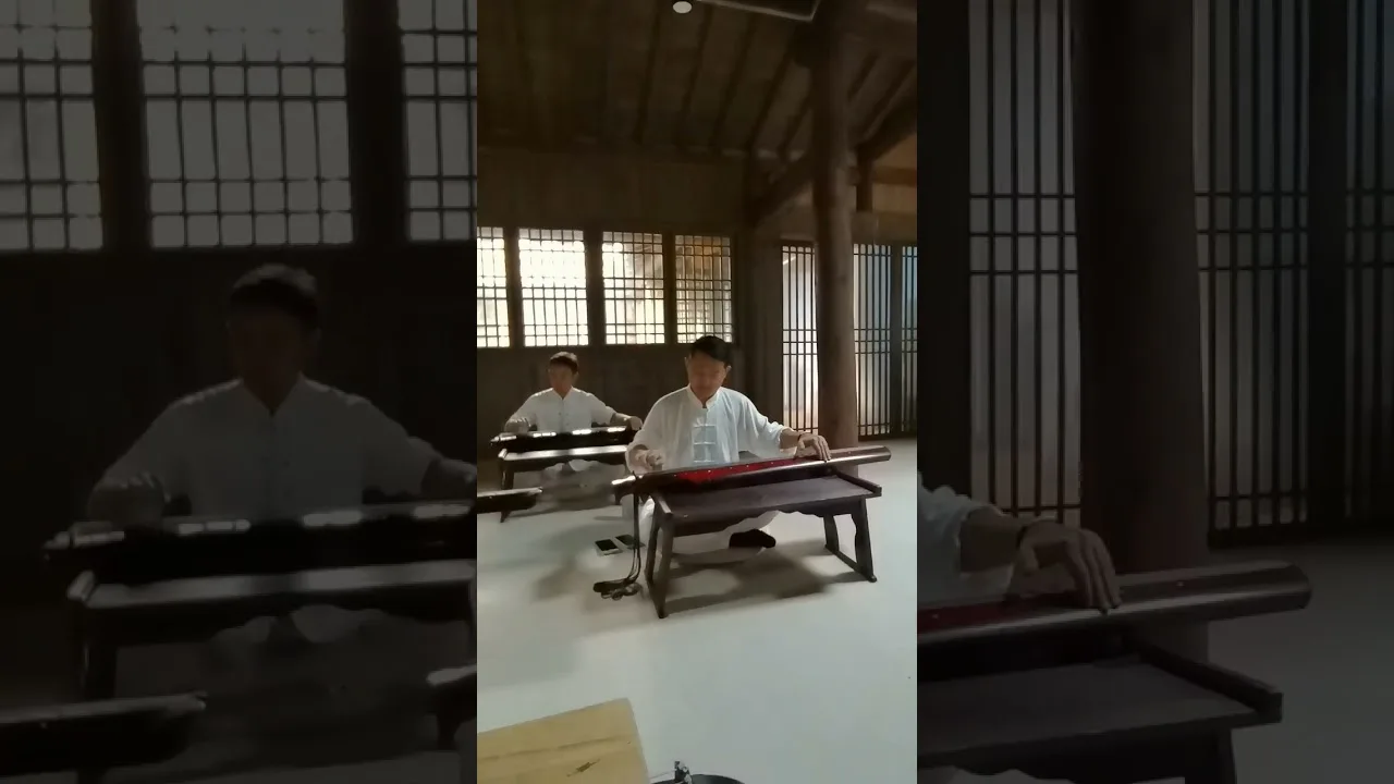 Three guqin in a wooden hall at Wudang Mountain during a practice session.